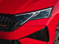 Close-up of the headlight and front grille of the 2025 Skoda Octavia RS in red