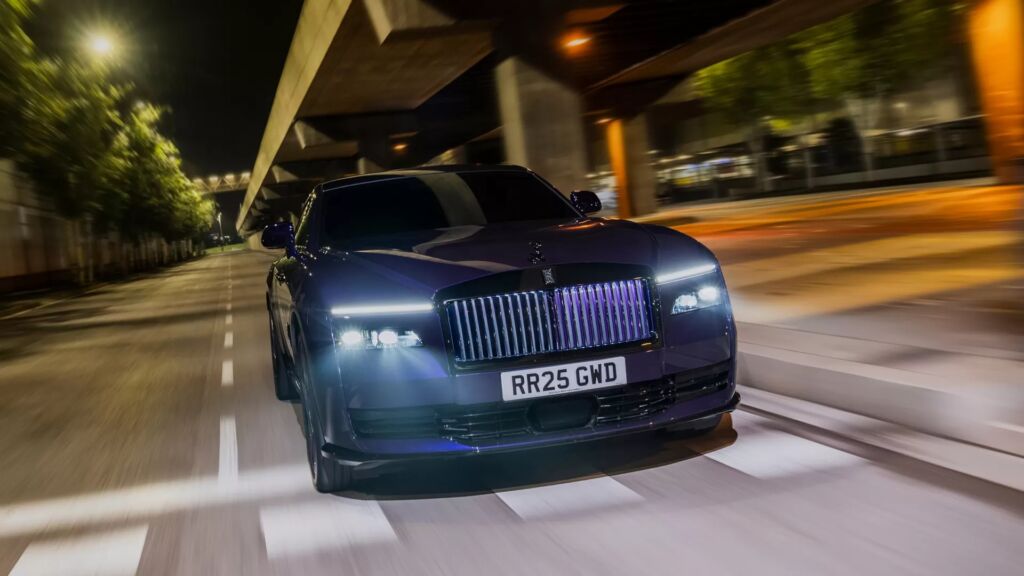 Rolls-Royce Spectre parked under moody lighting in an urban setting