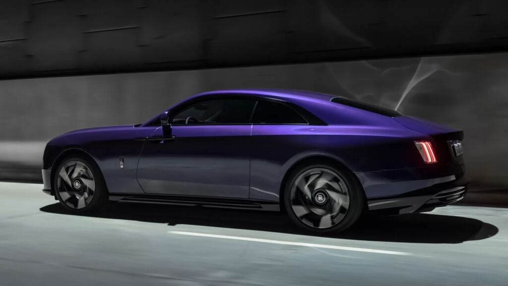 Rolls-Royce Spectre side view in motion with aerodynamic coupe design