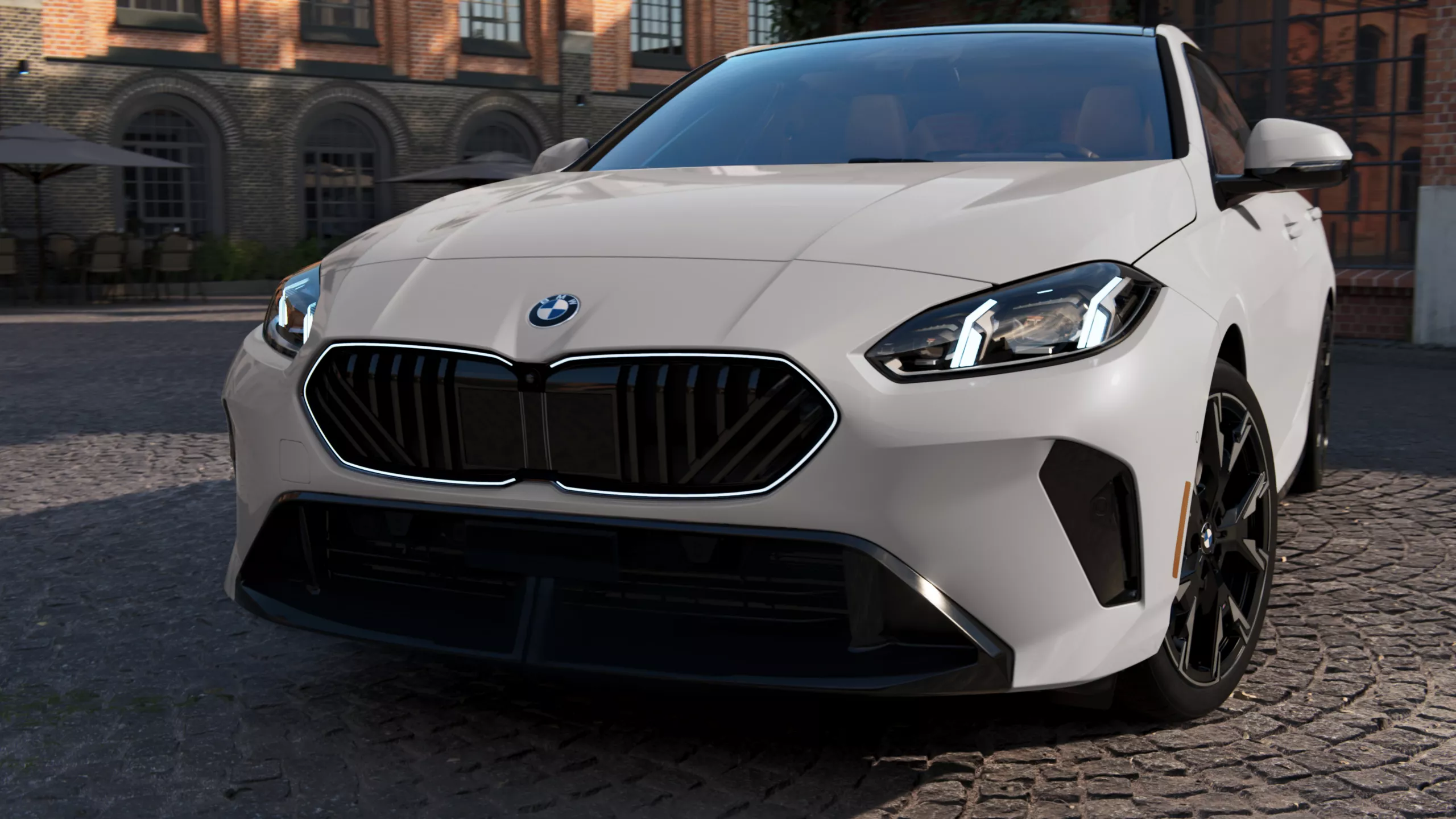 Front quarter angle of the BMW 2 Series with LED lights on