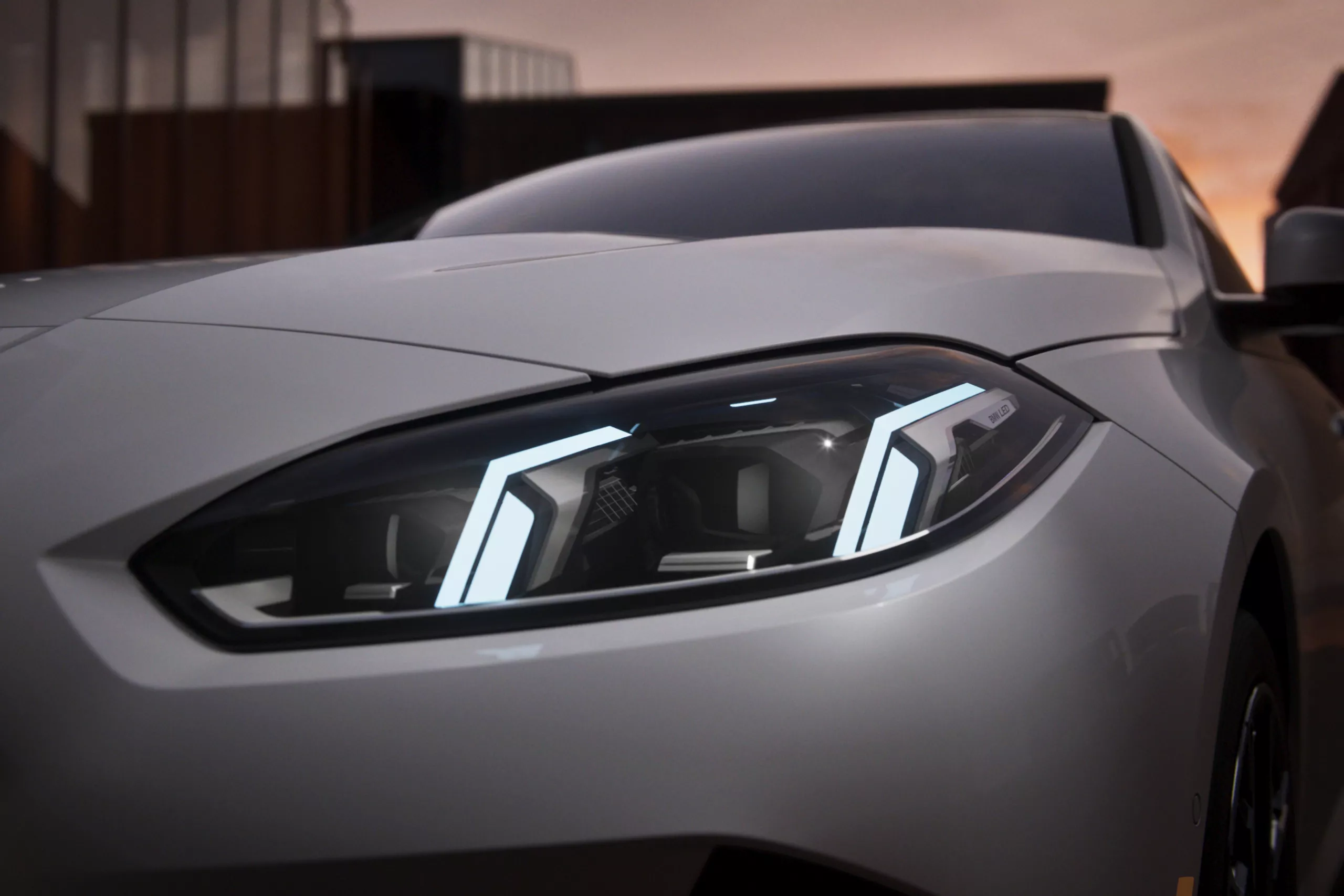Close-up of BMW 2 Series headlamp unit during sunset