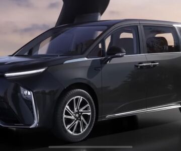 Front-side view of the upcoming MG M9 electric MPV in black with sleek LED headlamps and dual-tone design.